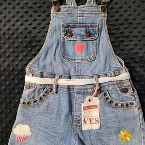 Girl's overall blue jean.